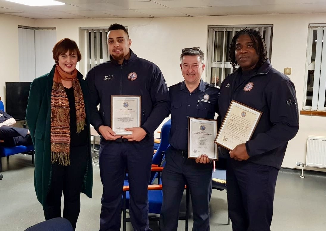 Firefighters Gene and Curtis Browne with Gene's wife Fiona and ACO John Baines, with their Chief Fire Officer's Commendation and Gene's 30 years long service certificate, following his retirement.