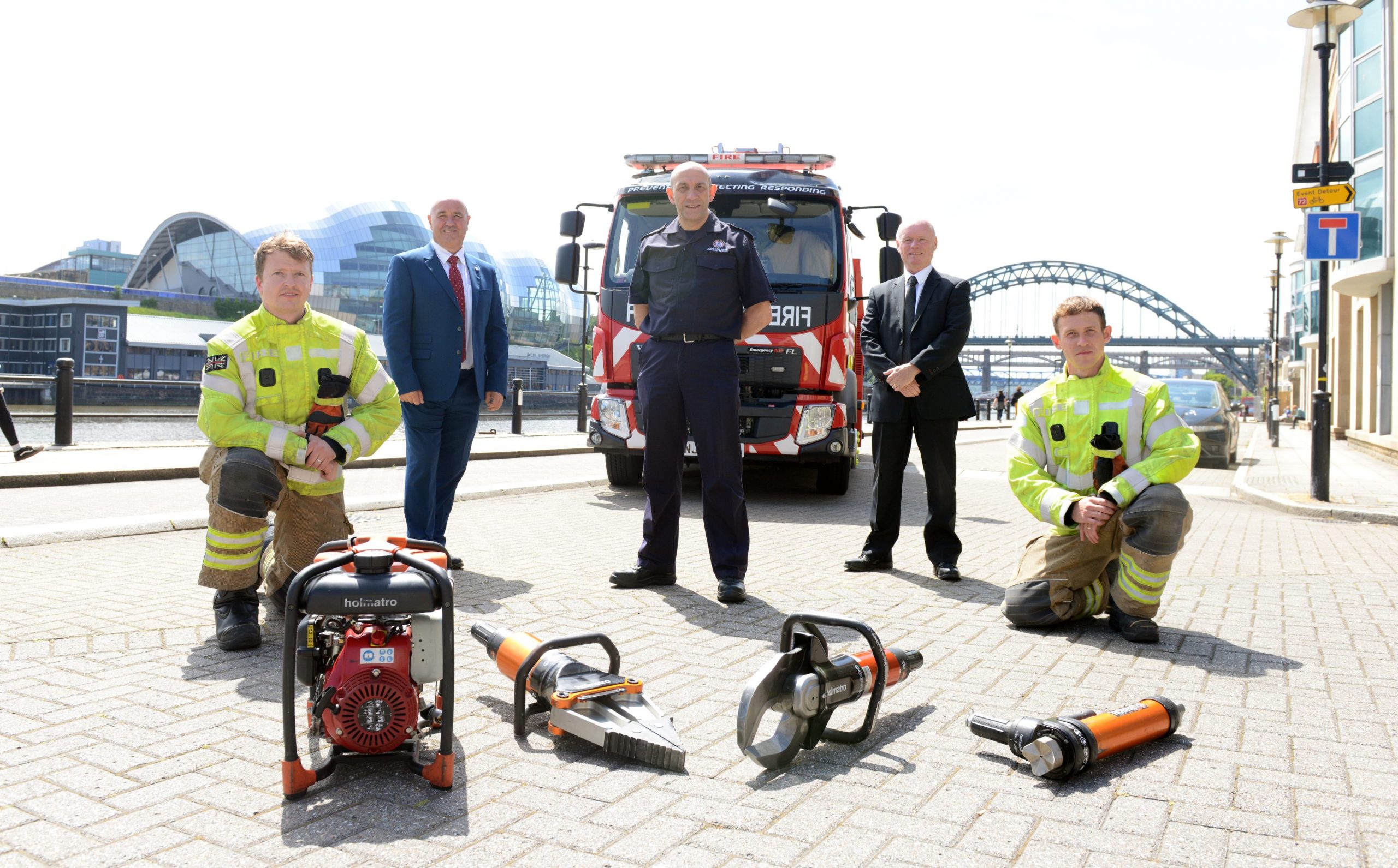(back row left to right) Councillor Ged Bell of Newcastle City Council; (middle) DCFO Peter Heath of TWFRS; Councillor Kevin Dodds, Gateshead councillor and member of the Tyne and Wear Fire and Rescue Authority. 

(Front row) TWFRS firefighters Philip Johnson & Scott Elliott 

All pictured on Newcastle Quayside where the UKRO event will be taking place in September.