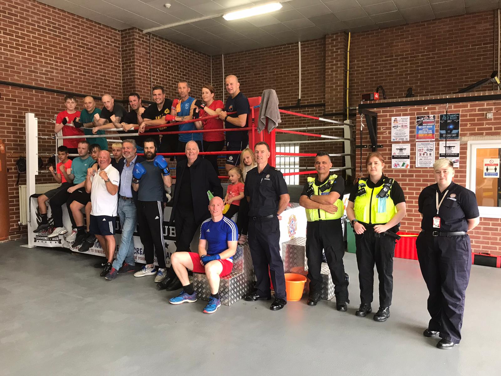 Members of The Sunderland Community Hub (SCH) with boxer Glenn McCrory 