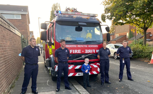 Finley with Firefighters from Byker Community Fire Station