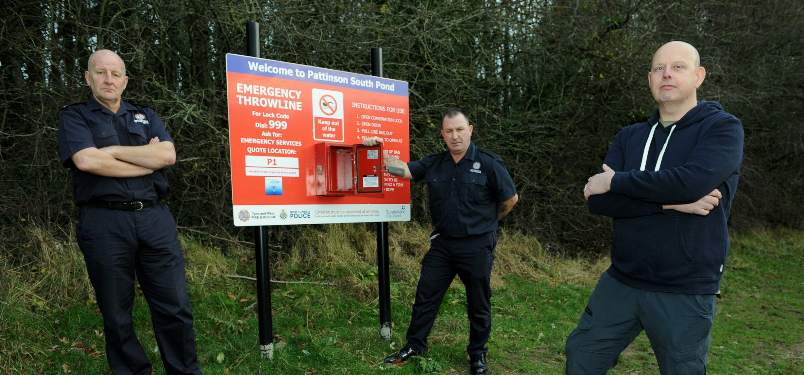 L to R - Mark Hayes, Prevention and Education Station Manager with Tommy Richardson, Prevention and Education Firefighter for @twfrs and Councillor Tony Taylor, Washington East councillor and Chair of Tyne and Wear Fire and Rescue Authority at the vandalised throwline board at Pattinson South Pond in Washington.