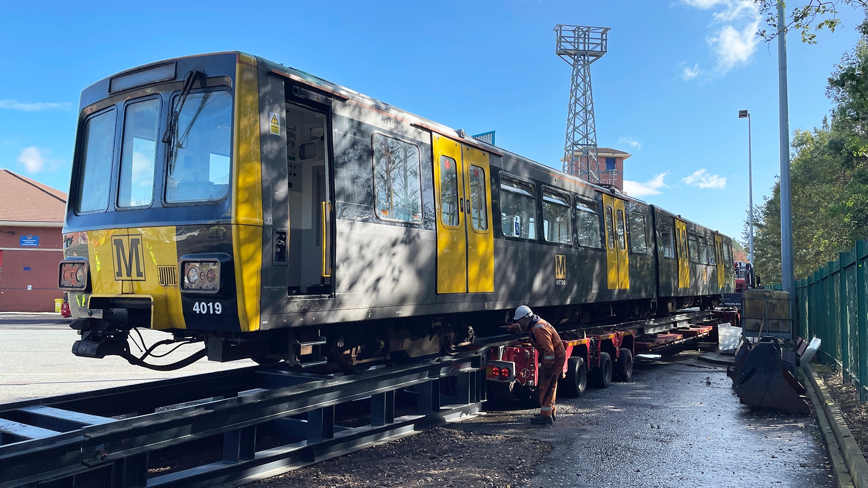 Decommissioned Nexus Metro train being loaded onto track at Tyne and Wear Fire and Rescue site
